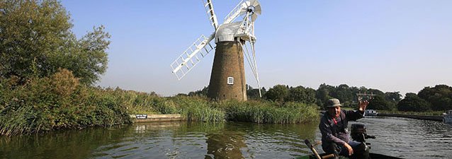 Traditional Reedcutter At work On The Norfolk Broads
